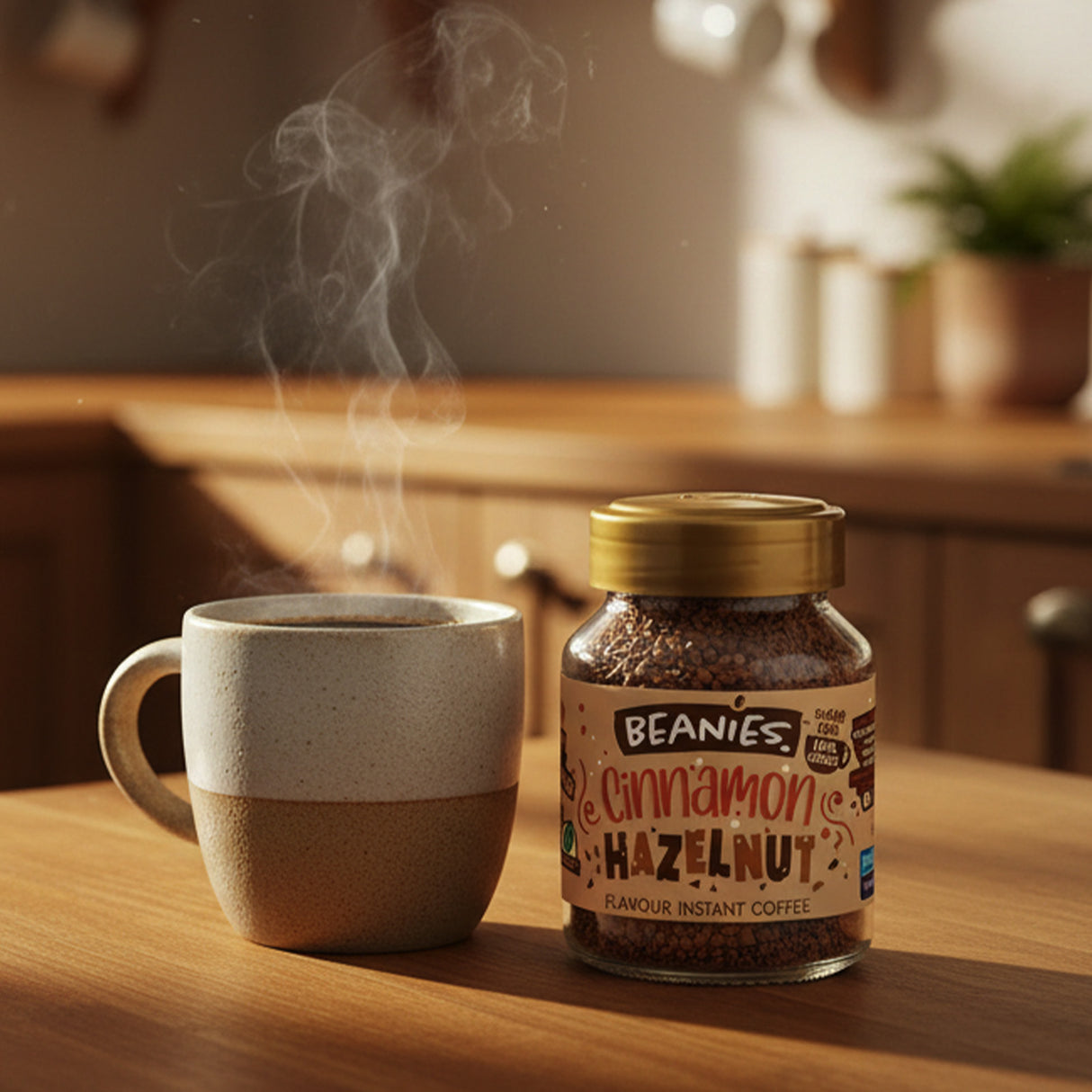 Steaming mug and jar of Beanies Cinnamon Hazelnut instant coffee on a wooden table.