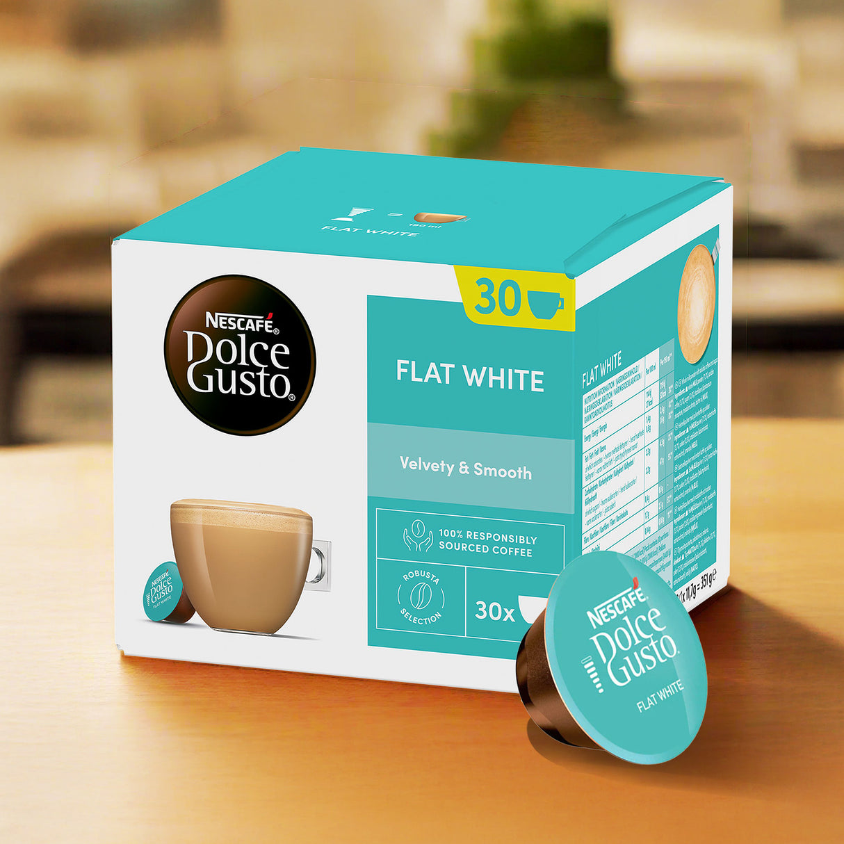 Nescafe Dolce Gusto Flat White coffee pod Magnum Pack on a wooden surface with a blurred background