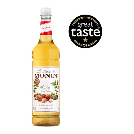 Monin hazelnut syrup bottle with Great Taste award logo on a white background