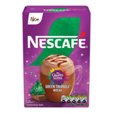 Nescafe packaging with a cup of coffee and Quality Street green triangle on a purple background