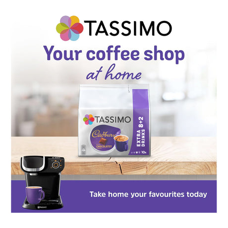 Tassimo coffee machine and Tassimo coffee packs on a table with a blurred background
