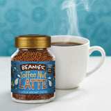 Jar of Beanies Toffee Nut Latte instant coffee with a steaming cup of coffee on a blue background