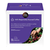 Nespresso Dolce Gusto coffee box packaging, featuring a white and purple design with a circular logo and a photo of a hand harvesting coffee beans.