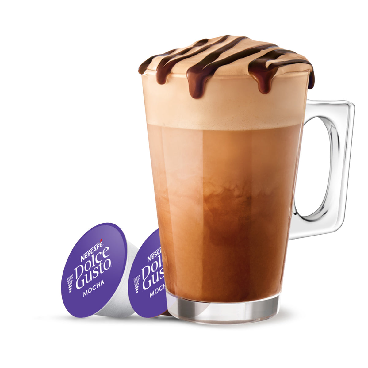 A tall clear glass mug filled with a mocha latte topped with whipped cream and chocolate drizzle, shown on a white background with two purple Nespresso Dolce Gusto coffee capsule packs beside it.