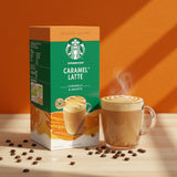 Starbucks Caramel Latte instant coffee packaging with a steaming cup of coffee on an orange background.