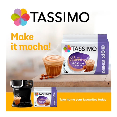 Tassimo Cadbury Mocha coffee packaging with a coffee machine and mocha cup on a wooden surface.