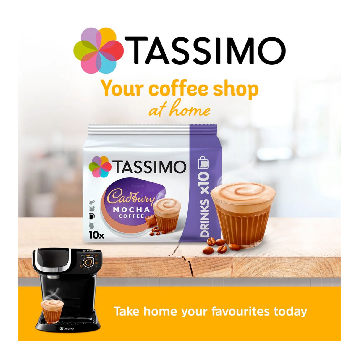 Tassimo coffee pod packaging with a coffee machine and cupcake on a wooden surface.