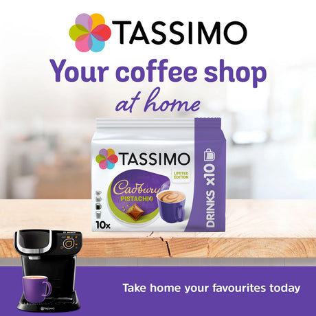 Tassimo coffee pod packaging with a Tassimo coffee machine on a wooden surface.