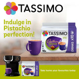 Tassimo Cadbury Pistachio coffee packaging with a purple mug and coffee machine on a wooden surface.